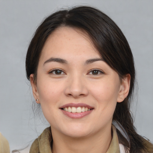 Joyful white young-adult female with medium  brown hair and brown eyes