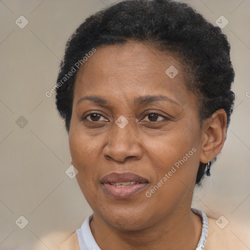 Joyful black adult female with short  brown hair and brown eyes