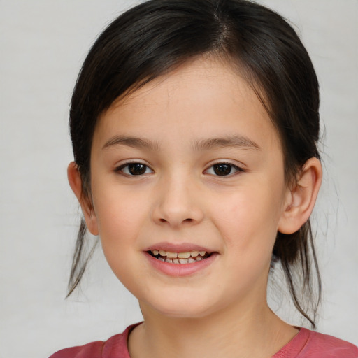 Joyful white child female with medium  brown hair and brown eyes