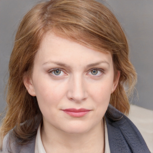 Joyful white young-adult female with medium  brown hair and blue eyes