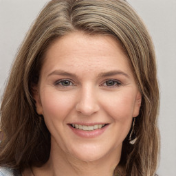 Joyful white young-adult female with medium  brown hair and grey eyes