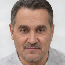 Joyful white middle-aged male with short  brown hair and brown eyes