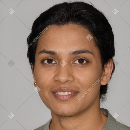 Joyful latino young-adult female with short  black hair and brown eyes