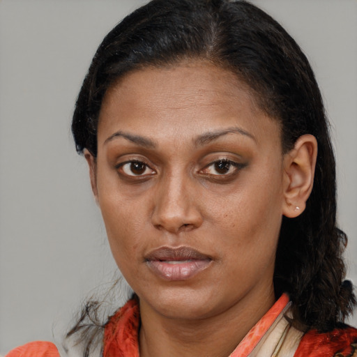 Neutral black young-adult female with medium  brown hair and brown eyes