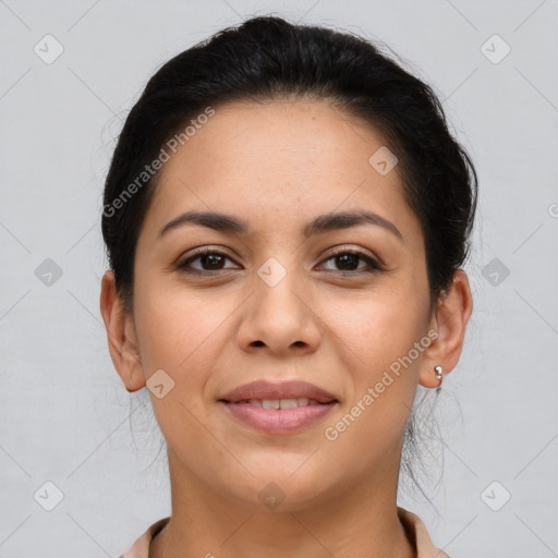 Joyful latino young-adult female with short  brown hair and brown eyes