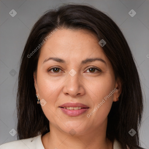 Joyful white adult female with medium  brown hair and brown eyes