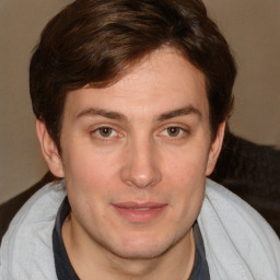 Joyful white young-adult male with medium  brown hair and brown eyes