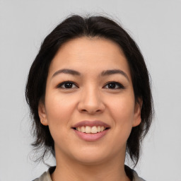 Joyful asian young-adult female with medium  brown hair and brown eyes