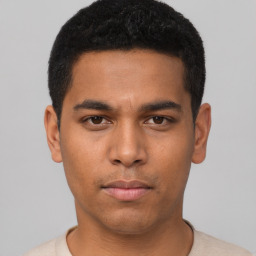 Neutral latino young-adult male with short  black hair and brown eyes