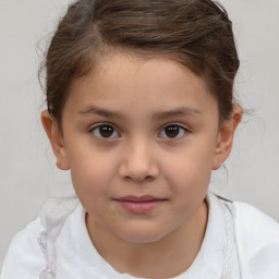 Joyful white child female with short  brown hair and brown eyes