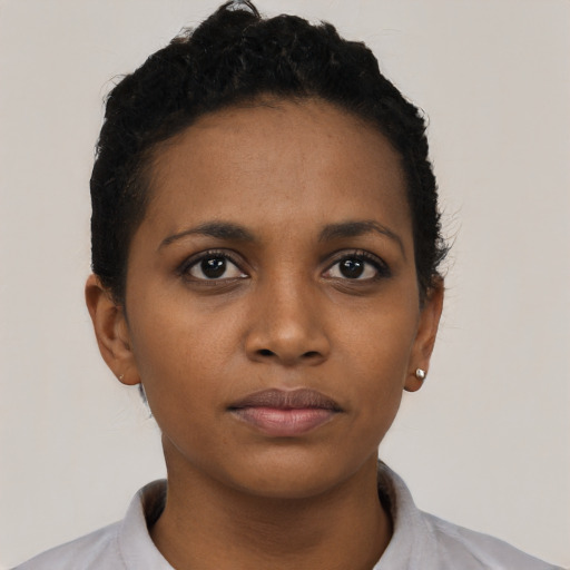 Neutral black young-adult female with short  black hair and brown eyes