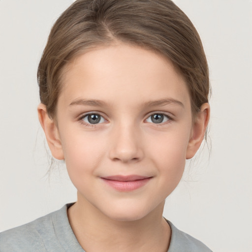 Joyful white child female with medium  brown hair and brown eyes