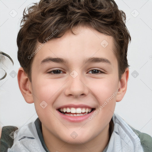 Joyful white child male with short  brown hair and brown eyes