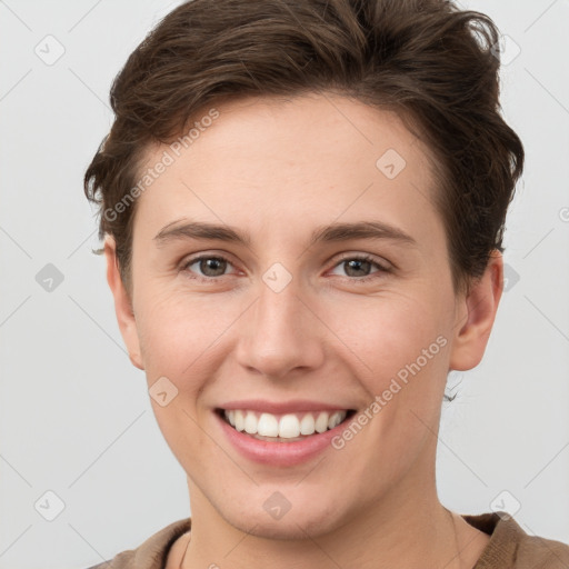 Joyful white young-adult female with short  brown hair and grey eyes