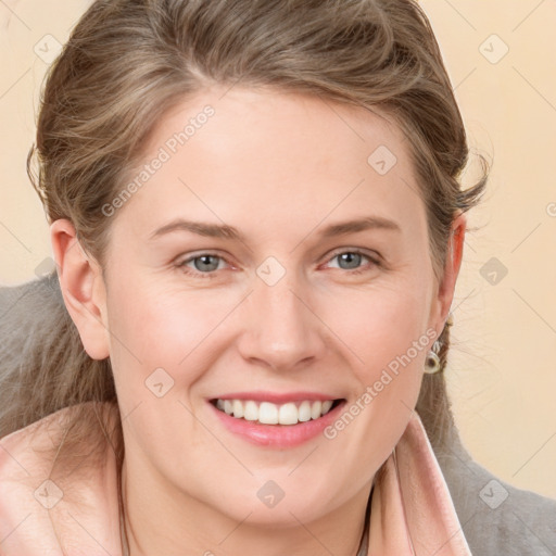 Joyful white young-adult female with medium  brown hair and blue eyes