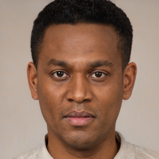 Neutral latino young-adult male with short  brown hair and brown eyes
