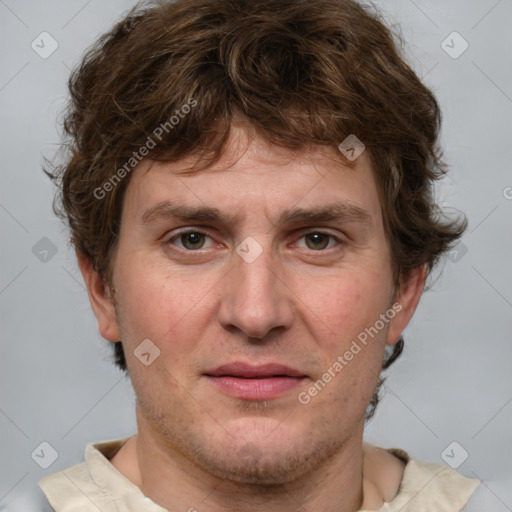 Joyful white adult male with short  brown hair and grey eyes