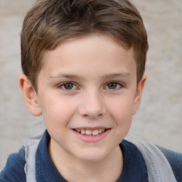 Joyful white child male with short  brown hair and grey eyes