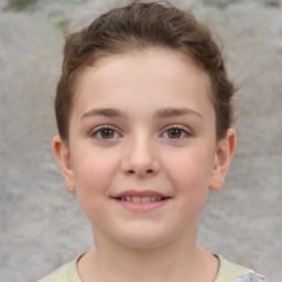 Joyful white child female with short  brown hair and brown eyes