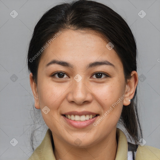 Joyful latino young-adult female with medium  brown hair and brown eyes