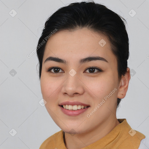 Joyful asian young-adult female with long  brown hair and brown eyes