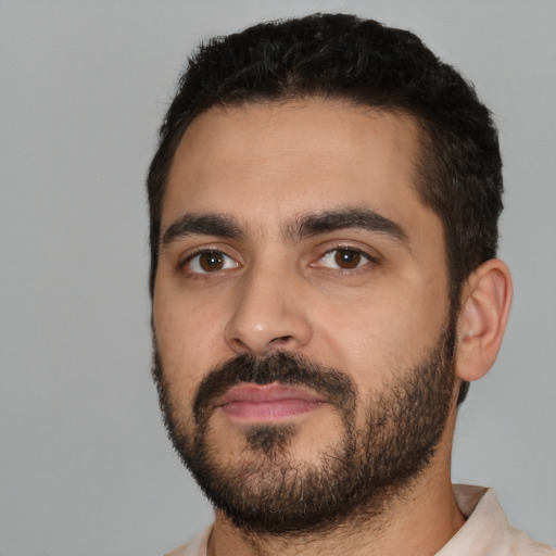 Neutral latino young-adult male with short  black hair and brown eyes