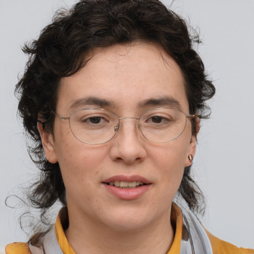 Joyful white adult female with medium  brown hair and brown eyes