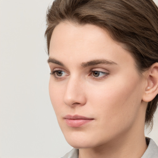 Neutral white young-adult female with medium  brown hair and brown eyes