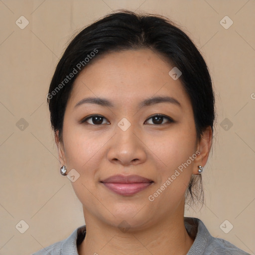 Joyful asian young-adult female with medium  black hair and brown eyes