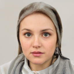 Neutral white young-adult female with short  brown hair and brown eyes