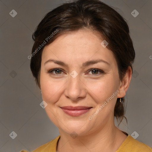 Joyful white adult female with medium  brown hair and brown eyes