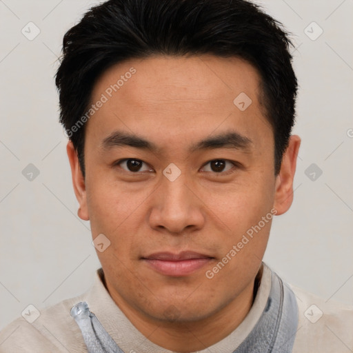 Joyful asian young-adult male with short  black hair and brown eyes