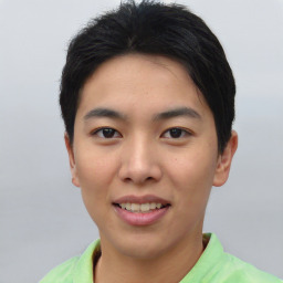 Joyful asian young-adult male with short  black hair and brown eyes