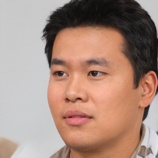 Neutral asian young-adult male with short  black hair and brown eyes