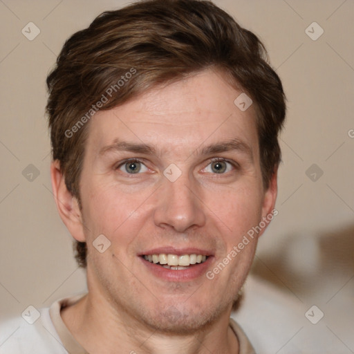 Joyful white adult male with short  brown hair and grey eyes