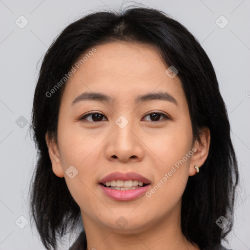 Joyful asian young-adult female with medium  brown hair and brown eyes