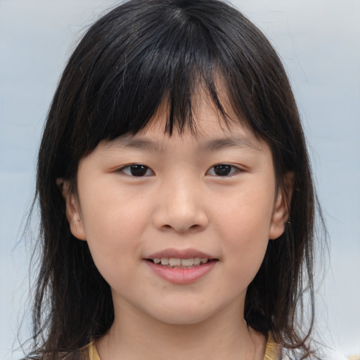 Joyful asian child female with medium  brown hair and brown eyes