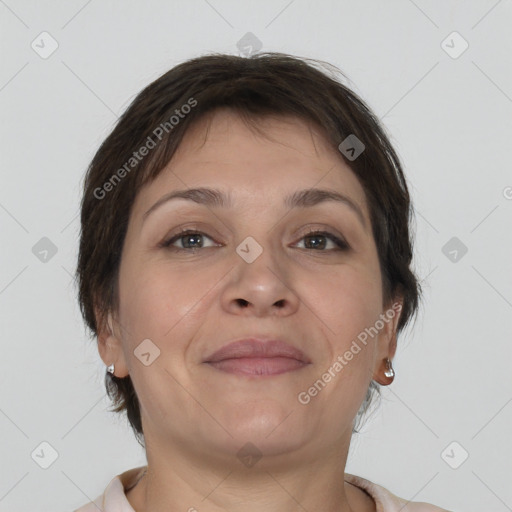 Joyful white adult female with short  brown hair and brown eyes