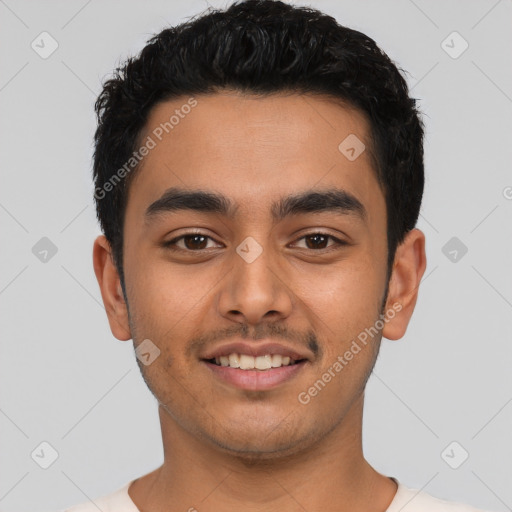 Joyful latino young-adult male with short  black hair and brown eyes