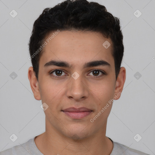 Joyful white young-adult male with short  black hair and brown eyes