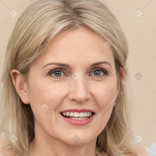 Joyful white adult female with medium  brown hair and grey eyes