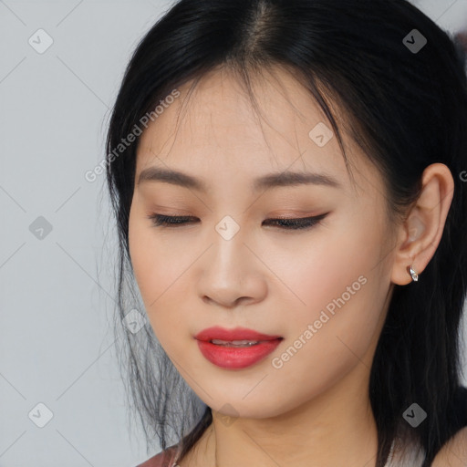 Joyful asian young-adult female with long  brown hair and brown eyes