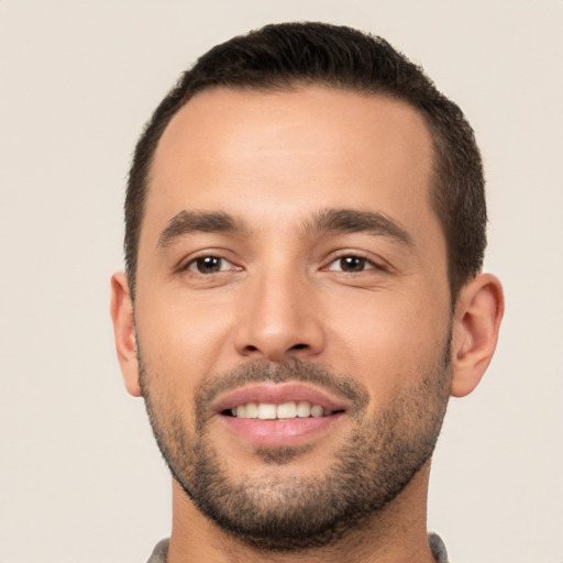 Joyful white young-adult male with short  brown hair and brown eyes