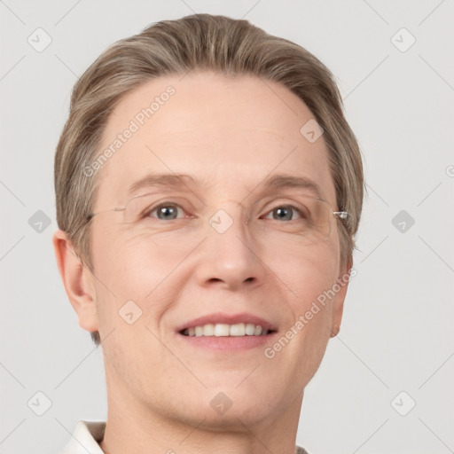 Joyful white adult male with short  brown hair and grey eyes