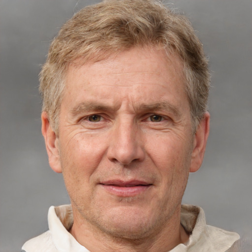 Joyful white middle-aged male with short  brown hair and grey eyes