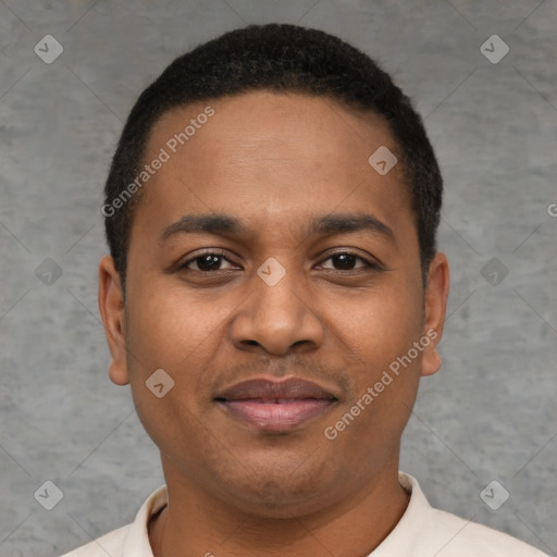 Joyful latino young-adult male with short  brown hair and brown eyes