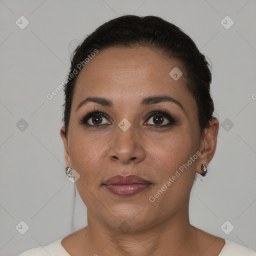 Joyful black adult female with short  brown hair and brown eyes