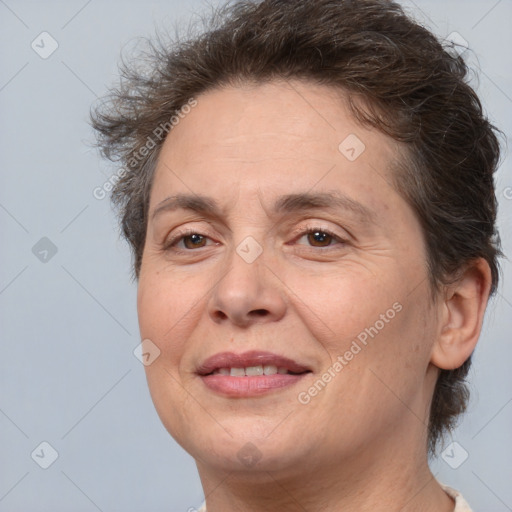 Joyful white adult female with short  brown hair and brown eyes