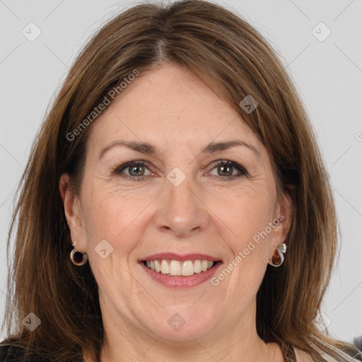 Joyful white adult female with long  brown hair and brown eyes