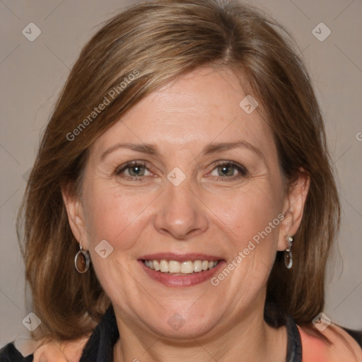 Joyful white adult female with medium  brown hair and blue eyes